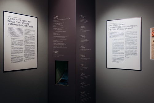 An exhibit with timeline and two panels